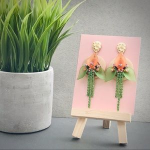Earrings with a wood floral pendant